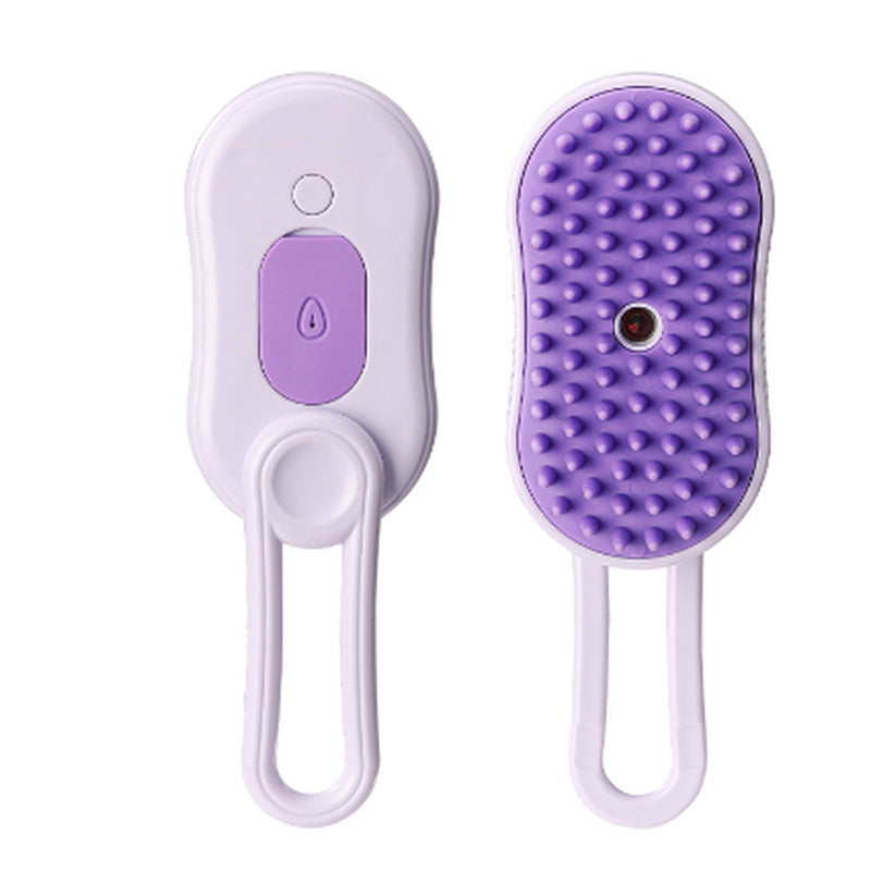 Cat being groomed with electric steam pet brush