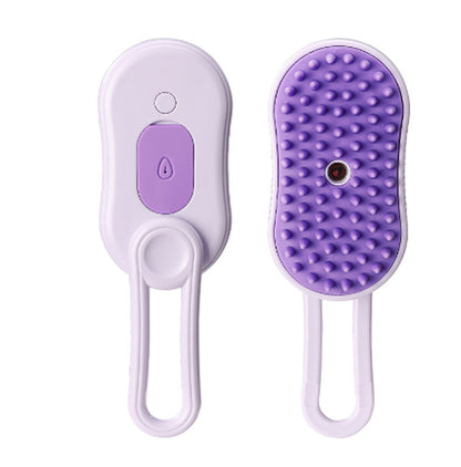 Cat being groomed with electric steam pet brush